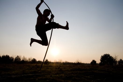 The silhouette of the person which jumps