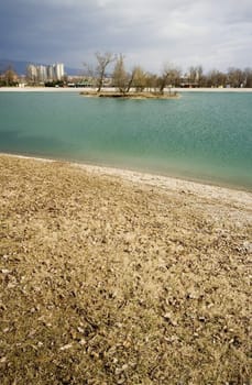 Turquise lake with island and coastline