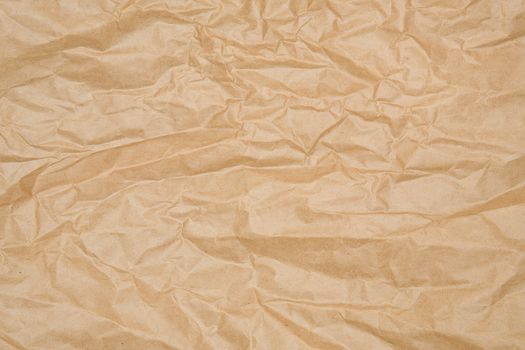 Crumpled piece of brown wrapping paper.