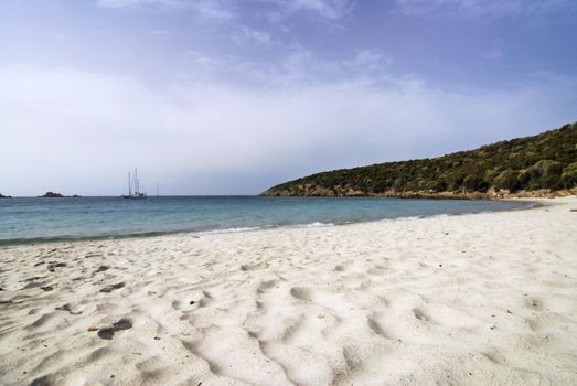 Romantic beach with white sand and boat