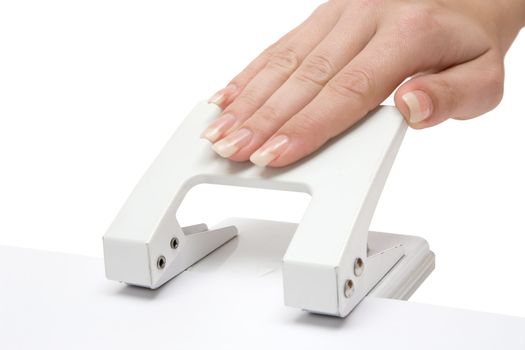 Woman using a white puncher. Isolated on a white background.