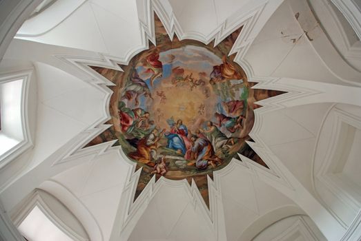 Cupola of cloister church with religious fresco