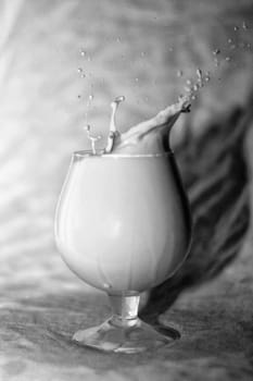 Glass of milk, drop splashes