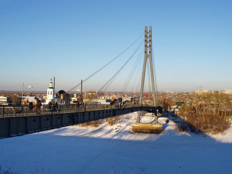 The foot bridge through the Tura river. The city of Tyumen