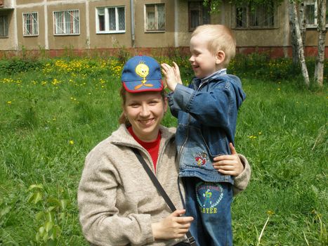 Happy family - mum and the son on walk