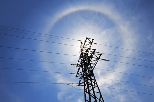 Amazing sun halo above high-voltage power supply network