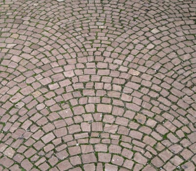 Streetway of stoneblock and grass background