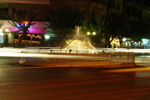 Fountain at night and trafic with long exposure