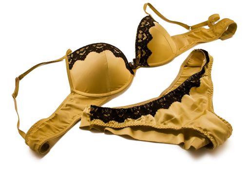 Sexy golden set of lingerie (bra and panties) isolated