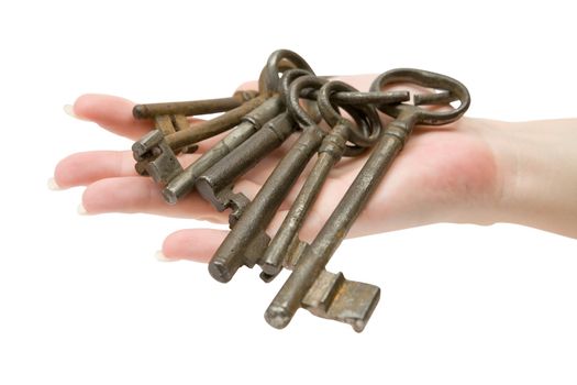 Female hand holding a rusty key ring. Isolated on a white background.