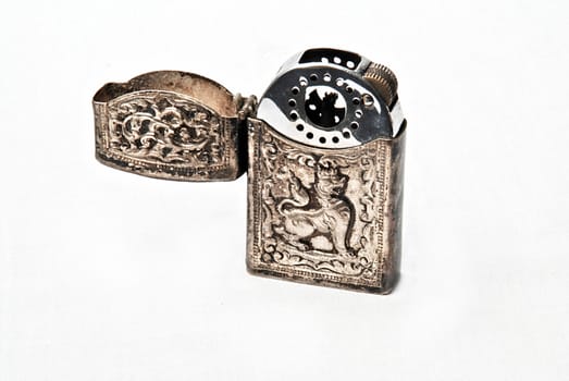 Ancient silver lighter with dragon engraving