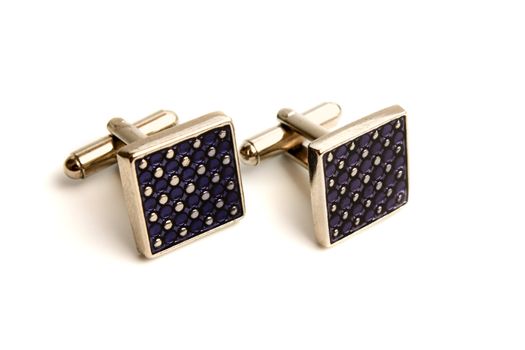 a pair of stainless steel cufflinks on white