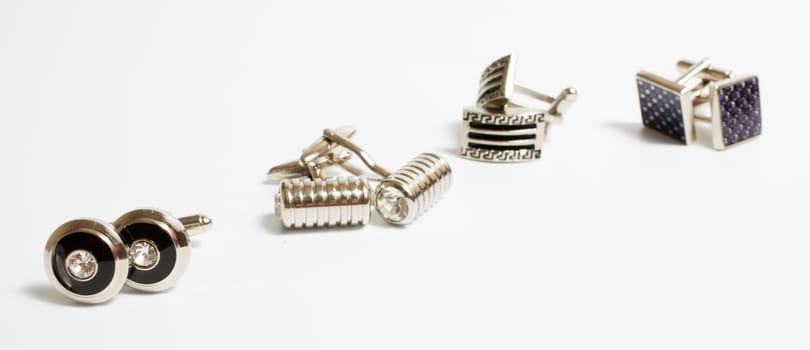 set of stainless steel cufflinks on white