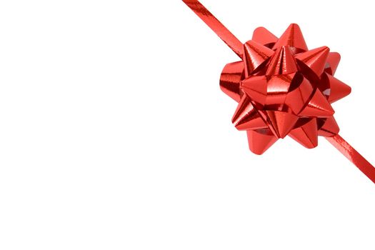 Red ribbon and bow isolated on a white background.