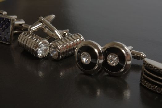 stainless steel cufflinks on the black background