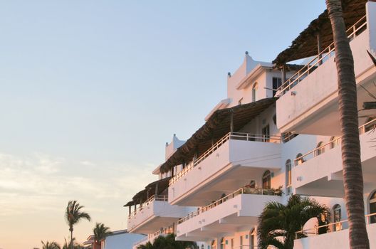 Condos in mexico overlooking the ocean at sunset