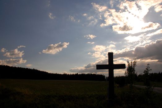 Christian cross during the sunset