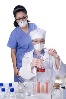 Young scientist in laboratory with test tubes and chemicals