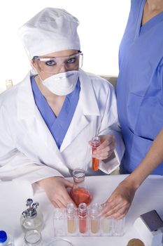 Young scientist in laboratory with test tubes and chemicals