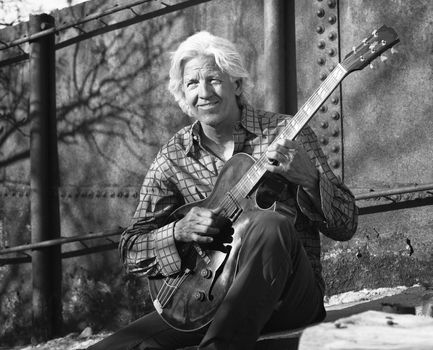 Guitar player with his instrument 