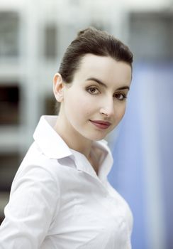 Portrait of young woman in modern office building environment