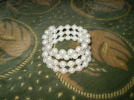 Beautiful bracelet from white pearl, concinnity and taste