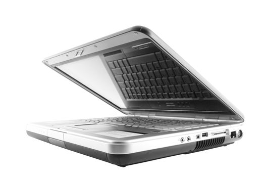 Half open isolated laptop with reflection of keys