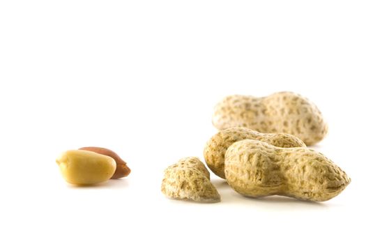 Peanuts on a white background shelled and unshelled