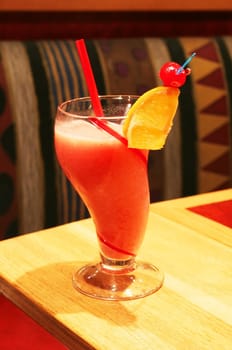 Berry smoothie with garnishments on restaurant table