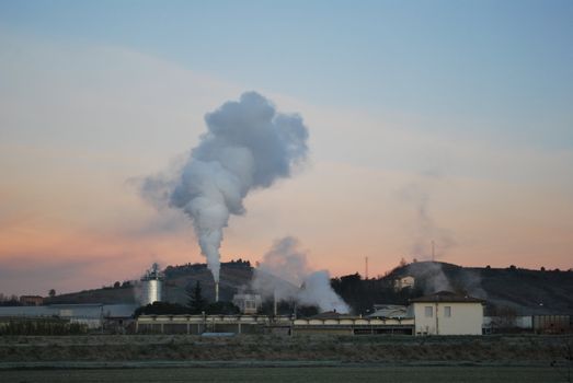 early morning sun tries to penetrate large thick clouds of pollution