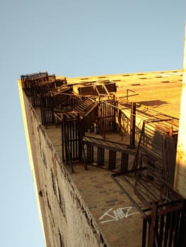 Corner view of a the rear of a building with a fire escape