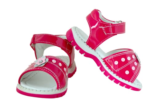 Pink baby's sandals. Brightly coloured. On isolated background.