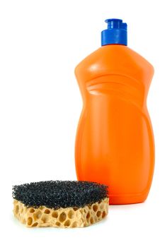 Detergent in orange plastic bottle and sponge on isolated background