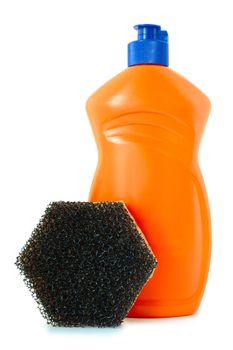 Detergent in orange plastic bottle and sponge on isolated background