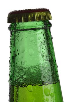 Backlit macro image of the top of a cold green beer bottle with condensation.