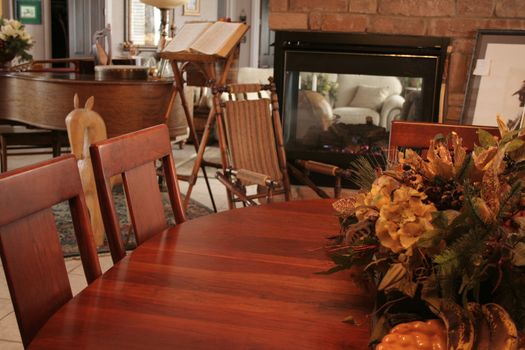 A cozy dining room table with fireplace