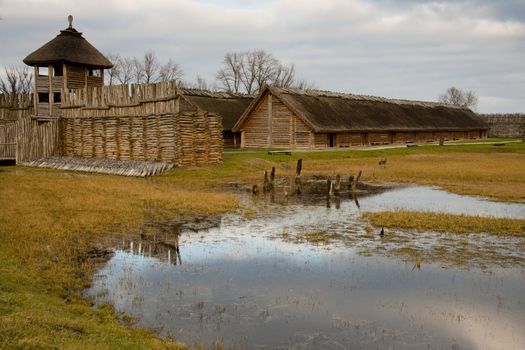 Wooden old historic cootage in Biskupin Village in Poland