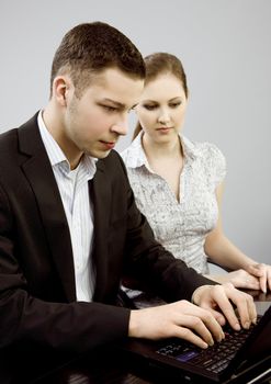 Business couple portrait - young man and woman working together