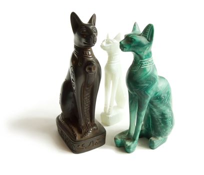 Stone Egyptian cats on a white background 