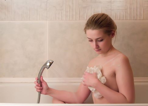 young beautiful girl in a bathroom