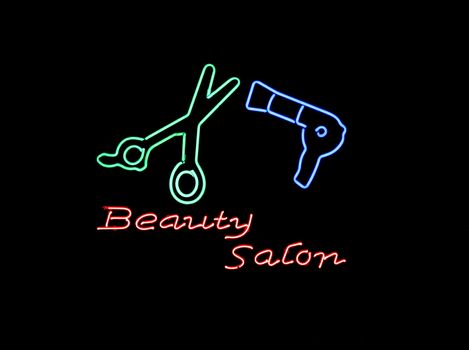 Neon sign often found in the window of a Beauty Salon
