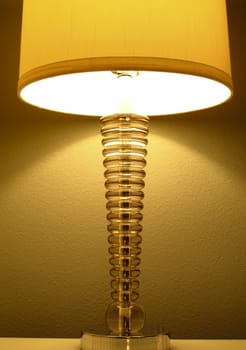 Bedside lamp lit and used for reading