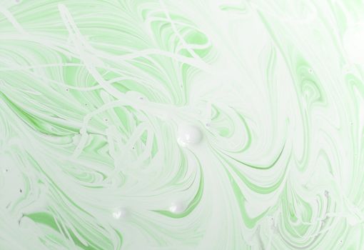 green paint after having been stirred