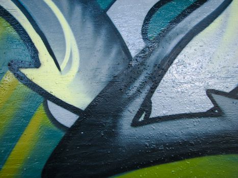 Glossy green graffiti on concrete wall