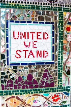 Outdoor mosaic with United We Stand written