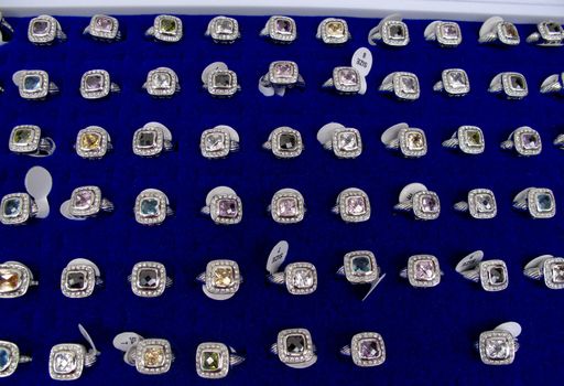 Assortment of silver rings at a market