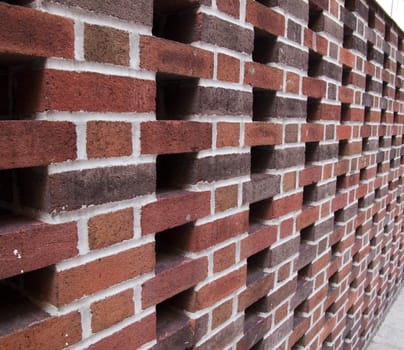 Angular view of red brick wall outside