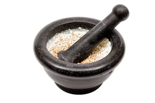 Grinding wheat grains. Isolated on a white background.