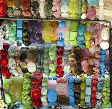 Several beaded bracelets at an outdoor market