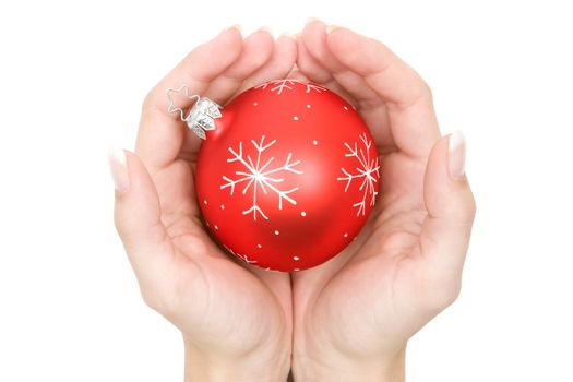 Holding a red Christmas bauble. Isolated on a white background.